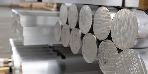 Alluminm Alloy Round Bars and Plates on Shelves In a Warehouse Alluminm Alloy Round Bars and Plates on Shelves In a Warehouse